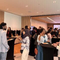 Attendees enjoying some light bites while networking