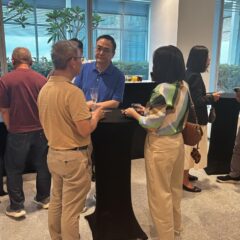Attendees networking over refreshments