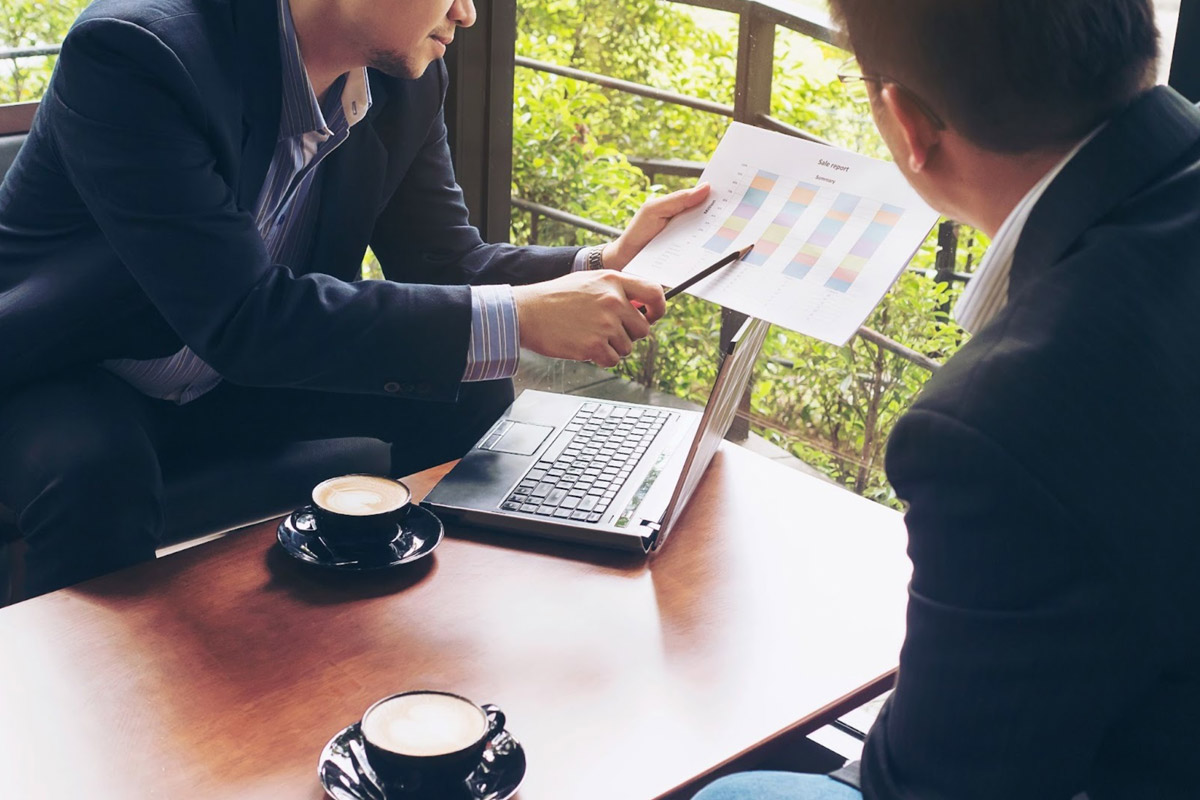 Partnering with Experts for FYE Compliance A corporate services professional providing FYE compliance guidance to a business owner.