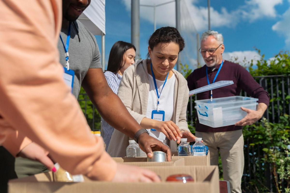 Social Enterprise Community Impact Volunteers from a social enterprise distributing food to a local community in need.