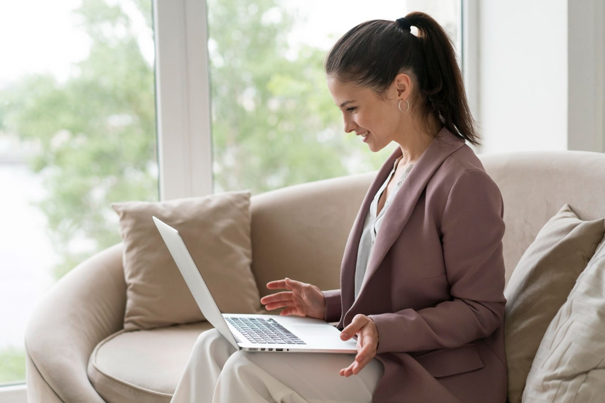 Female Employee Navigating GoBusiness Licensing on Her Laptop