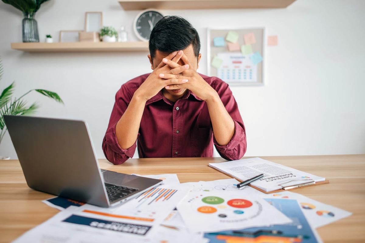 GST Filing Outsourcing Singapore: A Complete Guide Accountant reviewing GST filing documents at a desk in a Singapore office